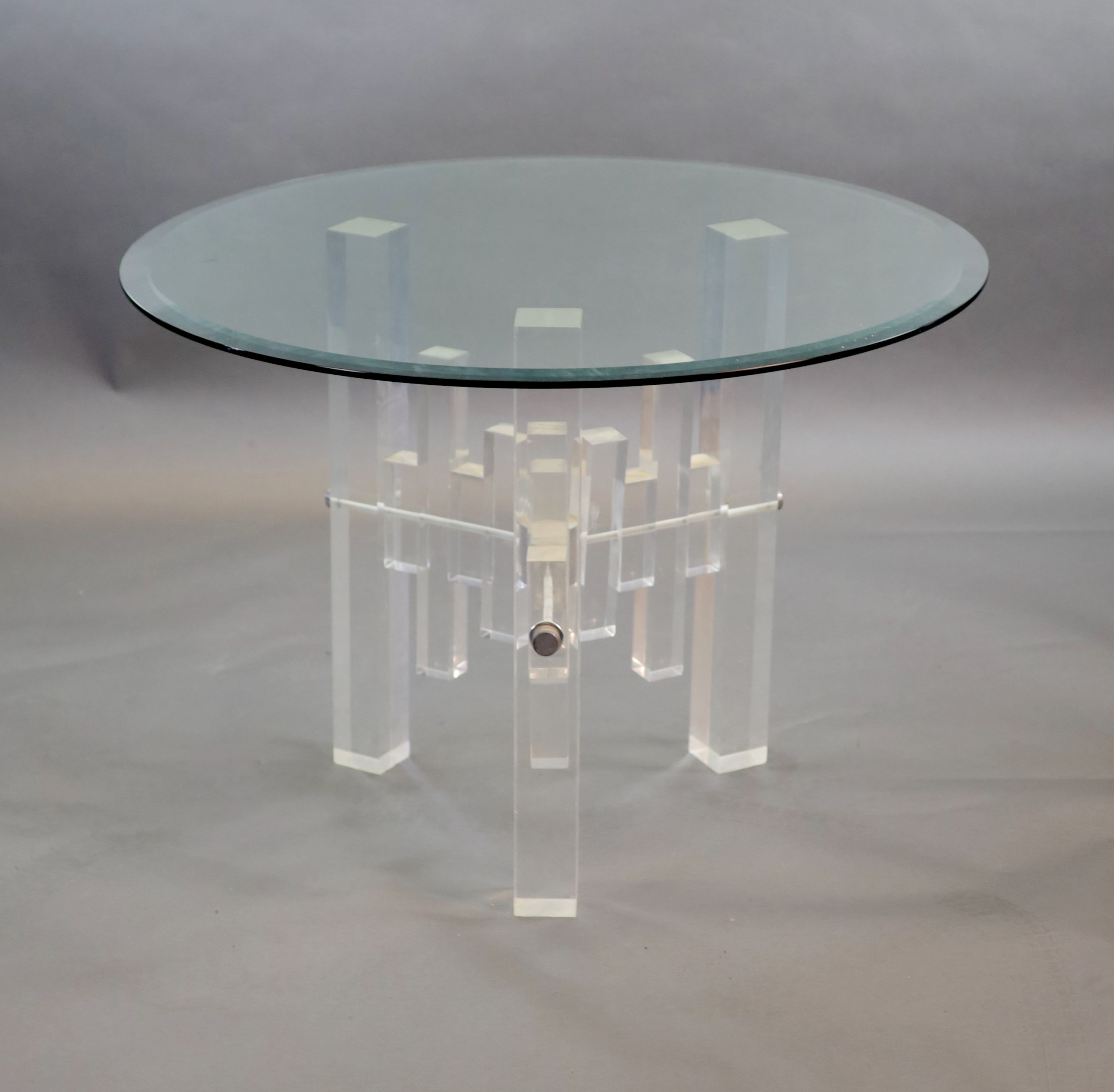 A 1970's German glass top table 107cm diameter, 76cm high.